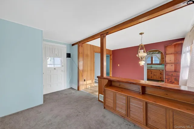 a view of a hallway with staircase