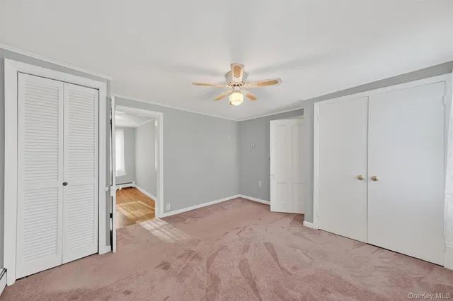 a bathroom with a sink a toilet and shower curtain