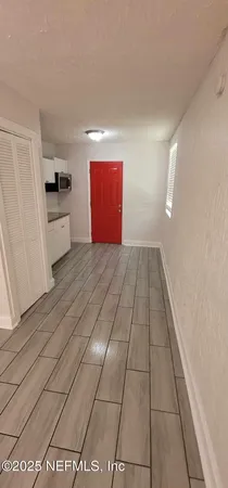 a view of a kitchen with a sink and a stove top oven