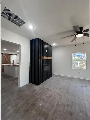 a view of an empty room with a cabinet