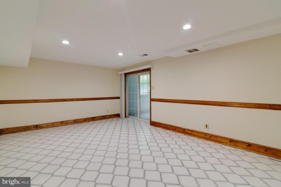 13613 Bethel Road Manassas, VA 20112 - Photo 55 of 66 Nice rec room with tile flooring