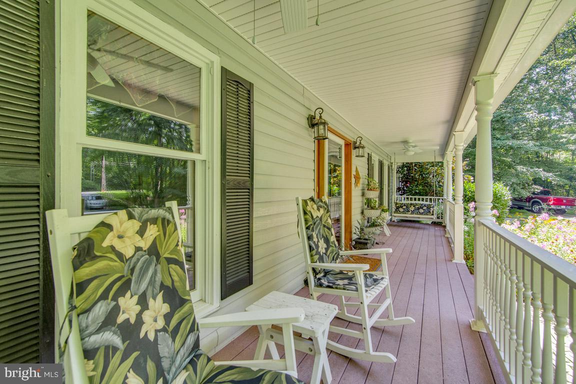 13613 Bethel Road Manassas, VA 20112 - Photo 7 of 66 Trek deck front porch with ceiling fans and swings