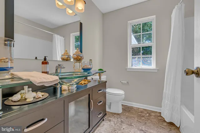 a room with stainless steel appliances a stove and a window