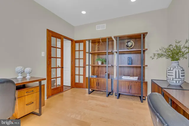 a bedroom with furniture and a window