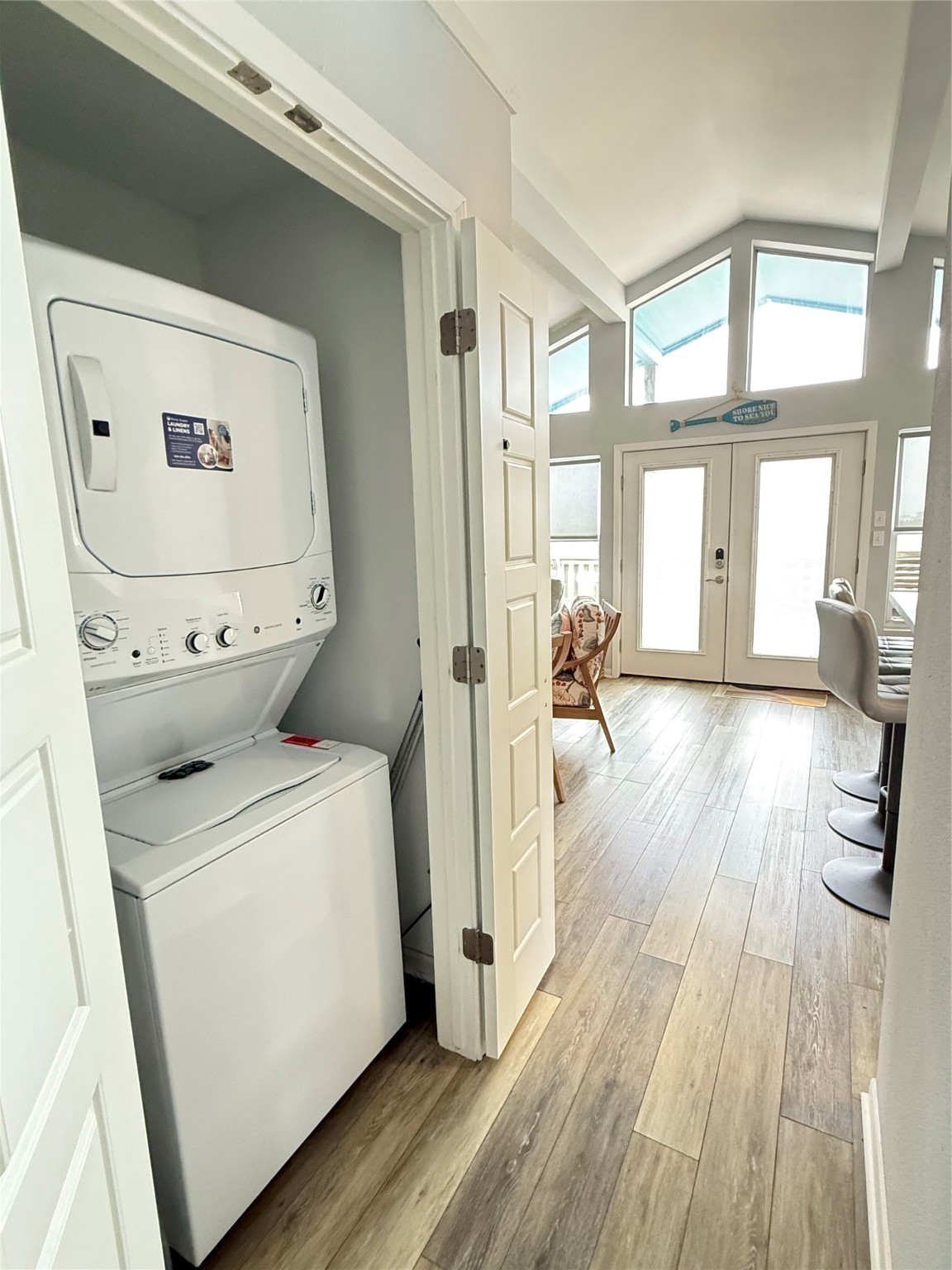925 Honeysuckle Crystal Beach, TX 77650 - Photo 11 of 20 a view of a hallway with wooden floor and cabinets