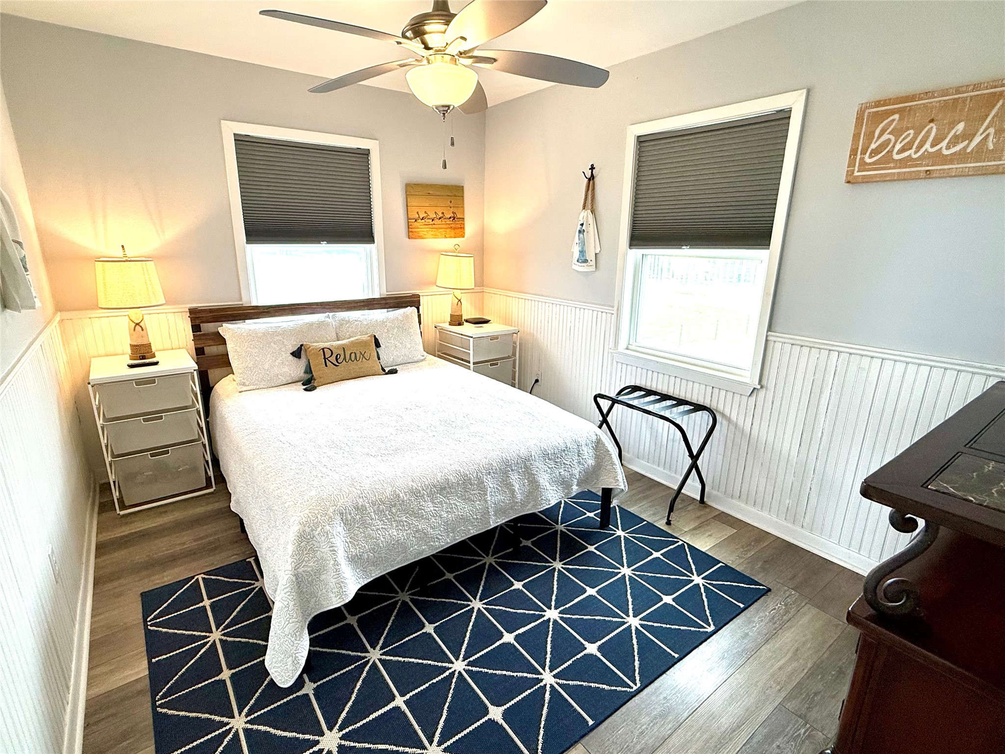 925 Honeysuckle Crystal Beach, TX 77650 - Photo 12 of 20 a bedroom with a bed and a flat screen tv