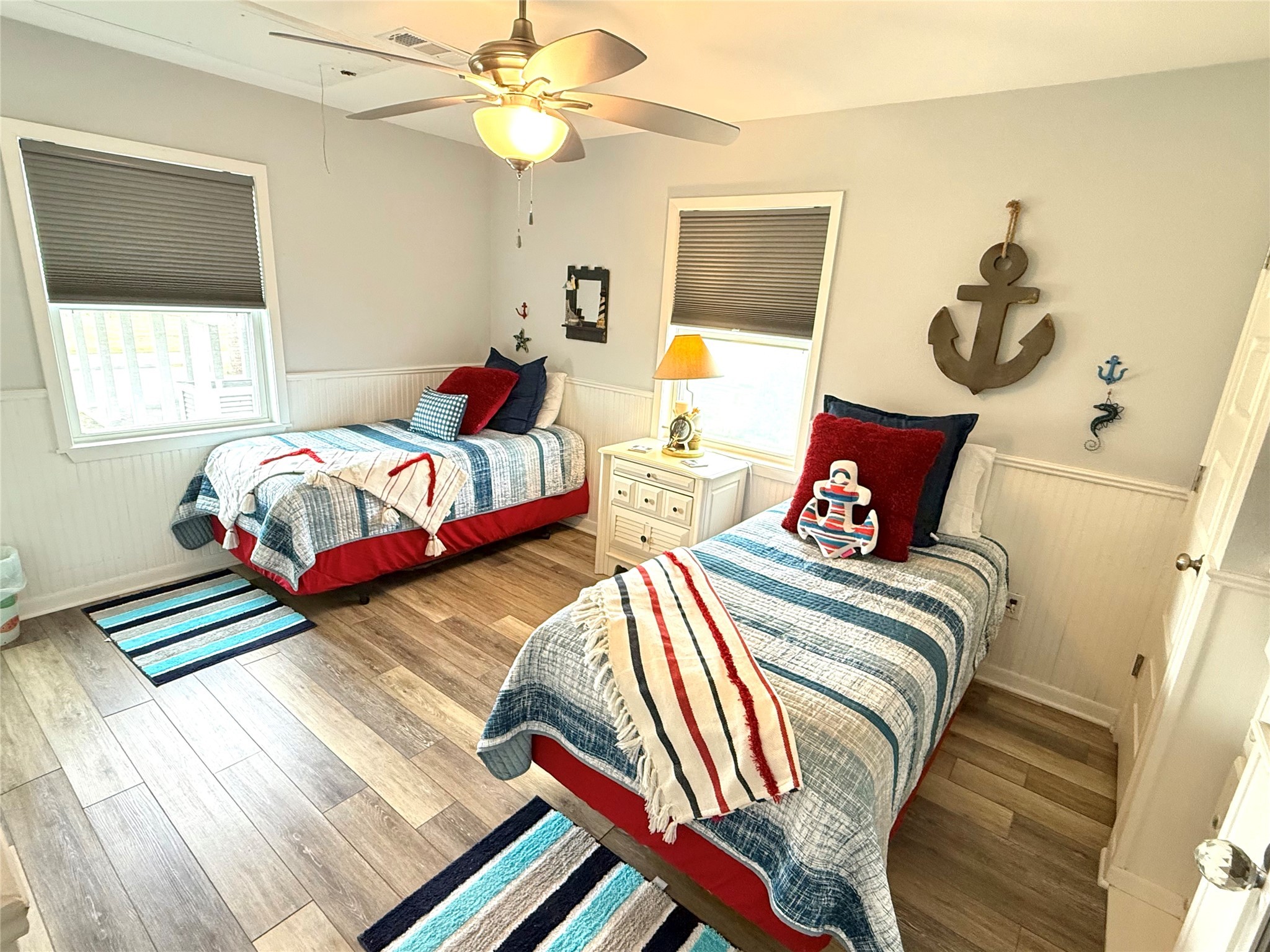 925 Honeysuckle Crystal Beach, TX 77650 - Photo 13 of 20 a bedroom with two beds and a window