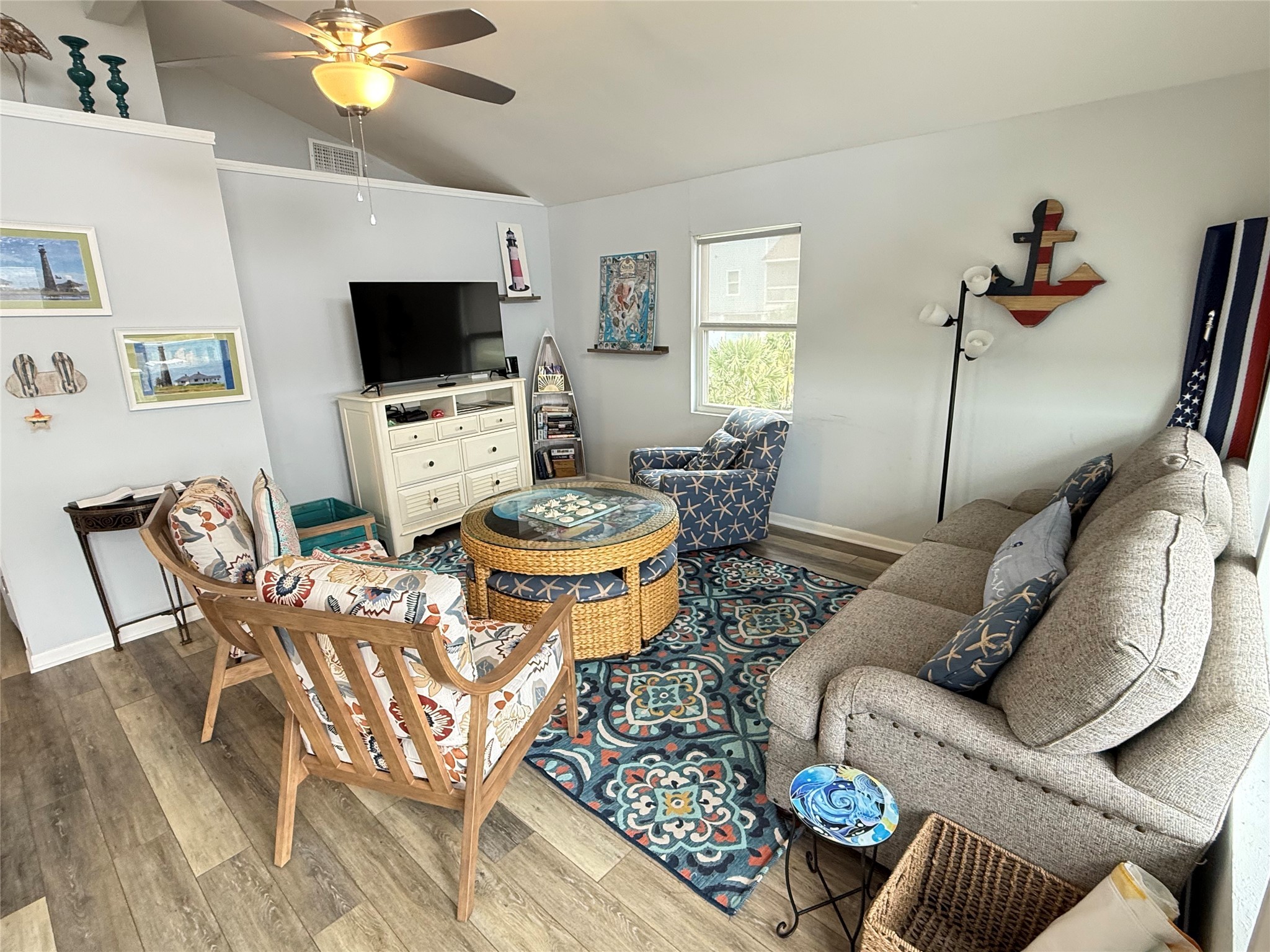 925 Honeysuckle Crystal Beach, TX 77650 - Photo 5 of 20 a living room with furniture and a flat screen tv