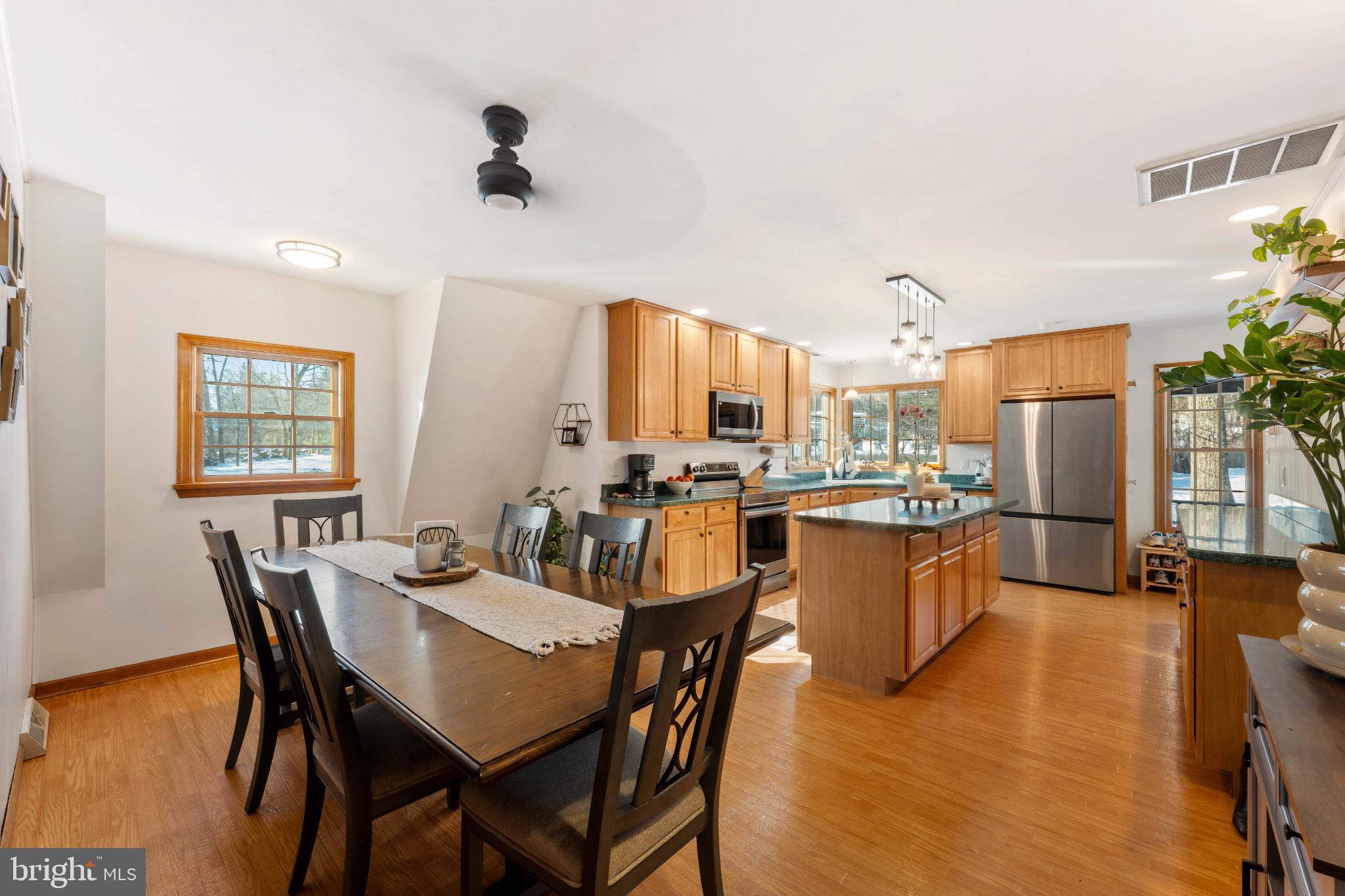 1596 River Road New Hope, PA 18938 - Photo 11 of 39 a view of a dining room with furniture and wooden floor