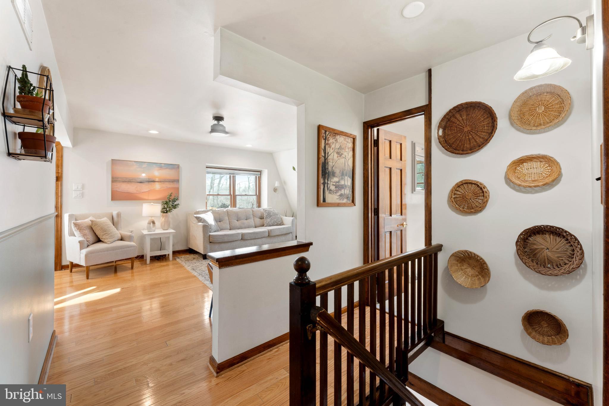 1596 River Road New Hope, PA 18938 - Photo 18 of 39 a living room with kitchen and a wooden floor