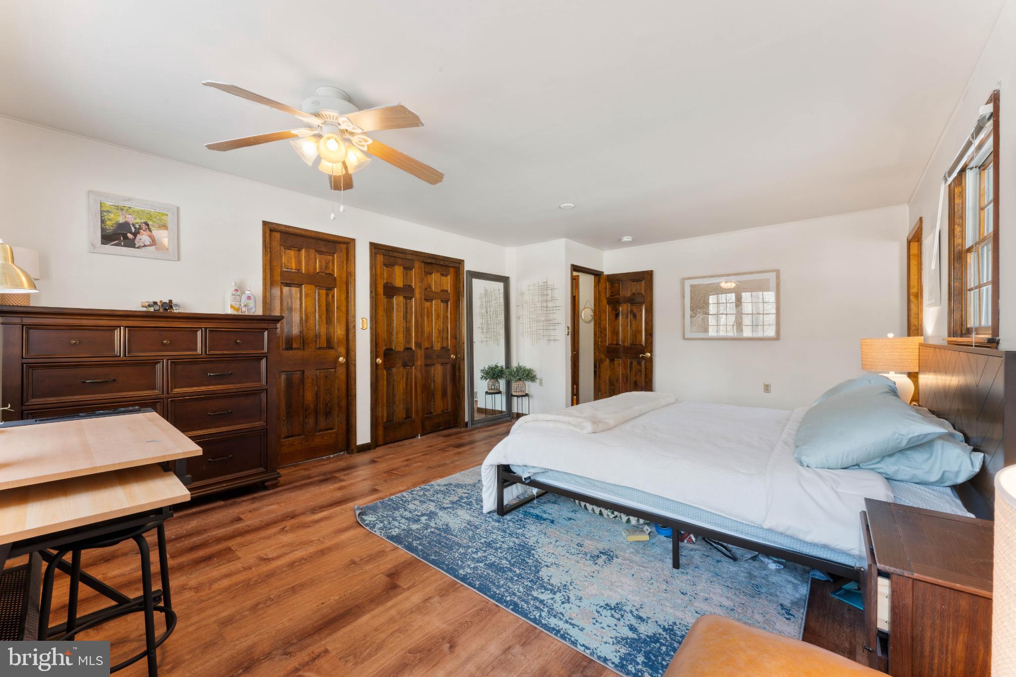 1596 River Road New Hope, PA 18938 - Photo 24 of 36 Spacious bedroom with warm wooden accents.