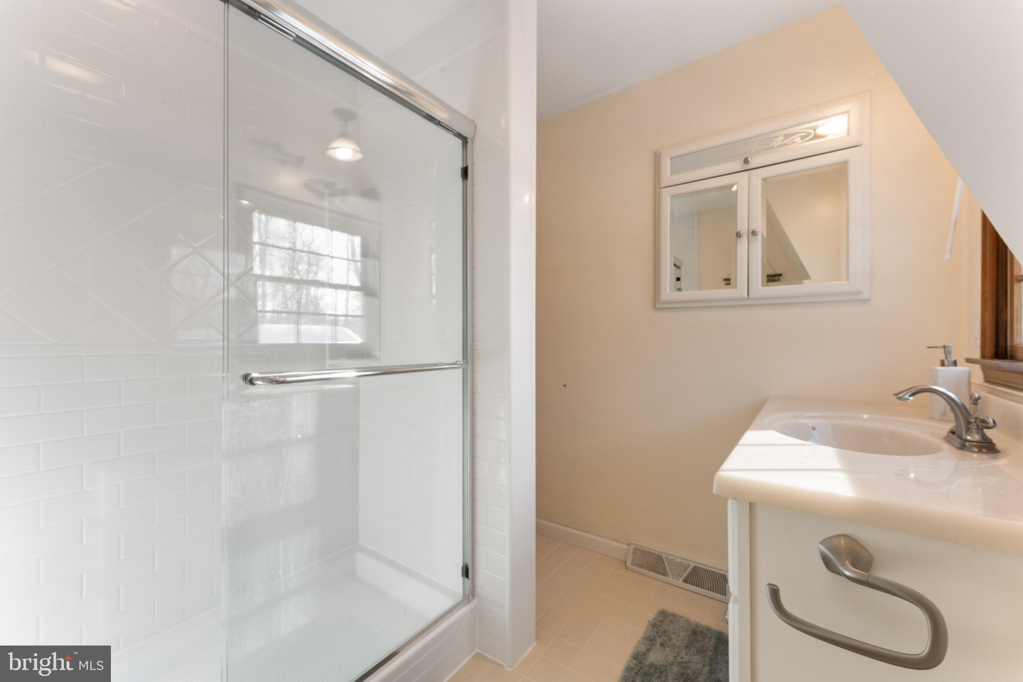 1596 River Road New Hope, PA 18938 - Photo 28 of 36 Modern bathroom with sleek glass shower.