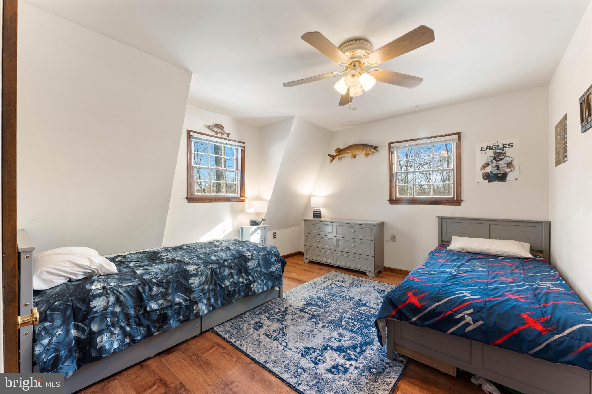 1596 River Road New Hope, PA 18938 - Photo 29 of 39 a bedroom with a bed and a chandelier