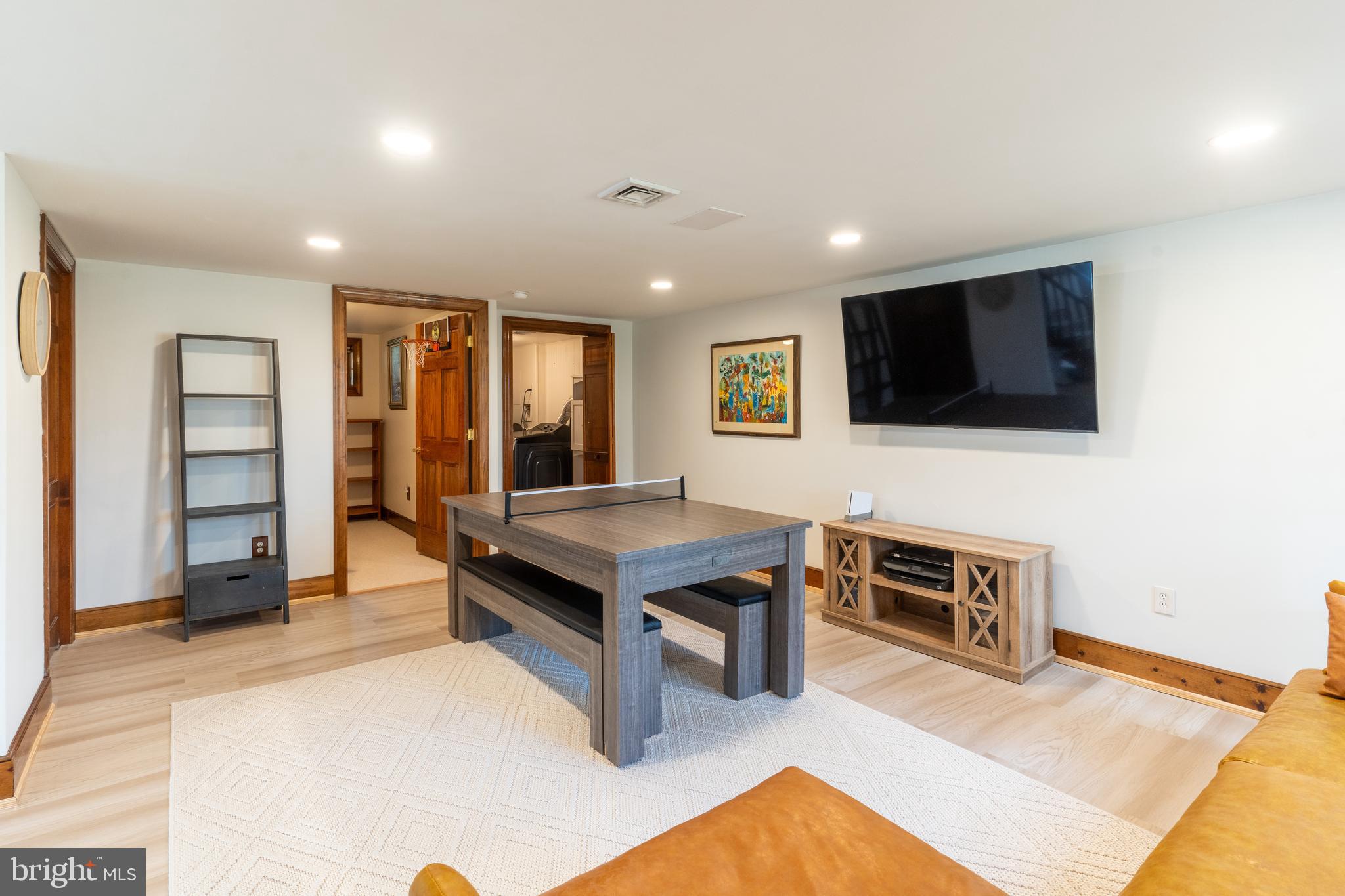 1596 River Road New Hope, PA 18938 - Photo 35 of 39 a living room with furniture a flat screen tv and kitchen view