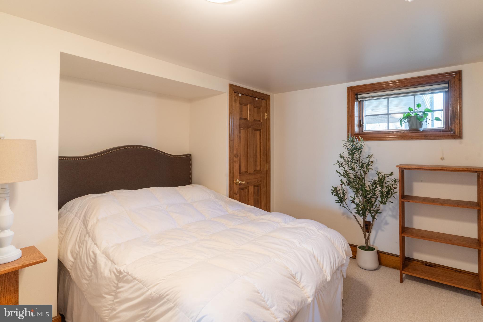 1596 River Road New Hope, PA 18938 - Photo 39 of 39 a bedroom with a bed and a potted plant