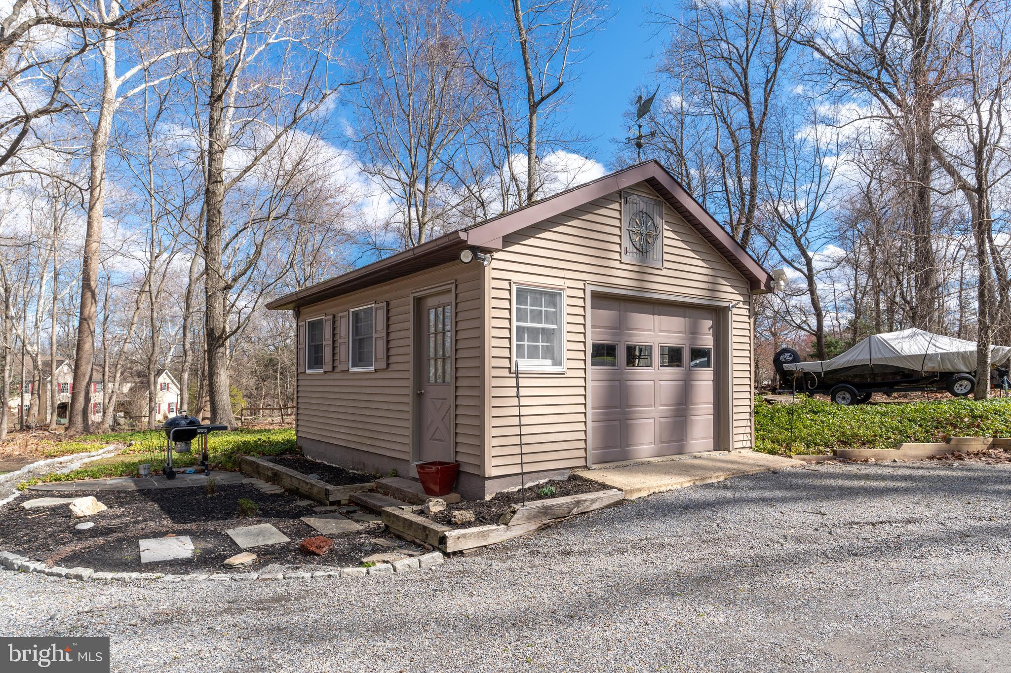 1596 River Road New Hope, PA 18938 - Photo 7 of 39 a front view of a house with a yard and garage