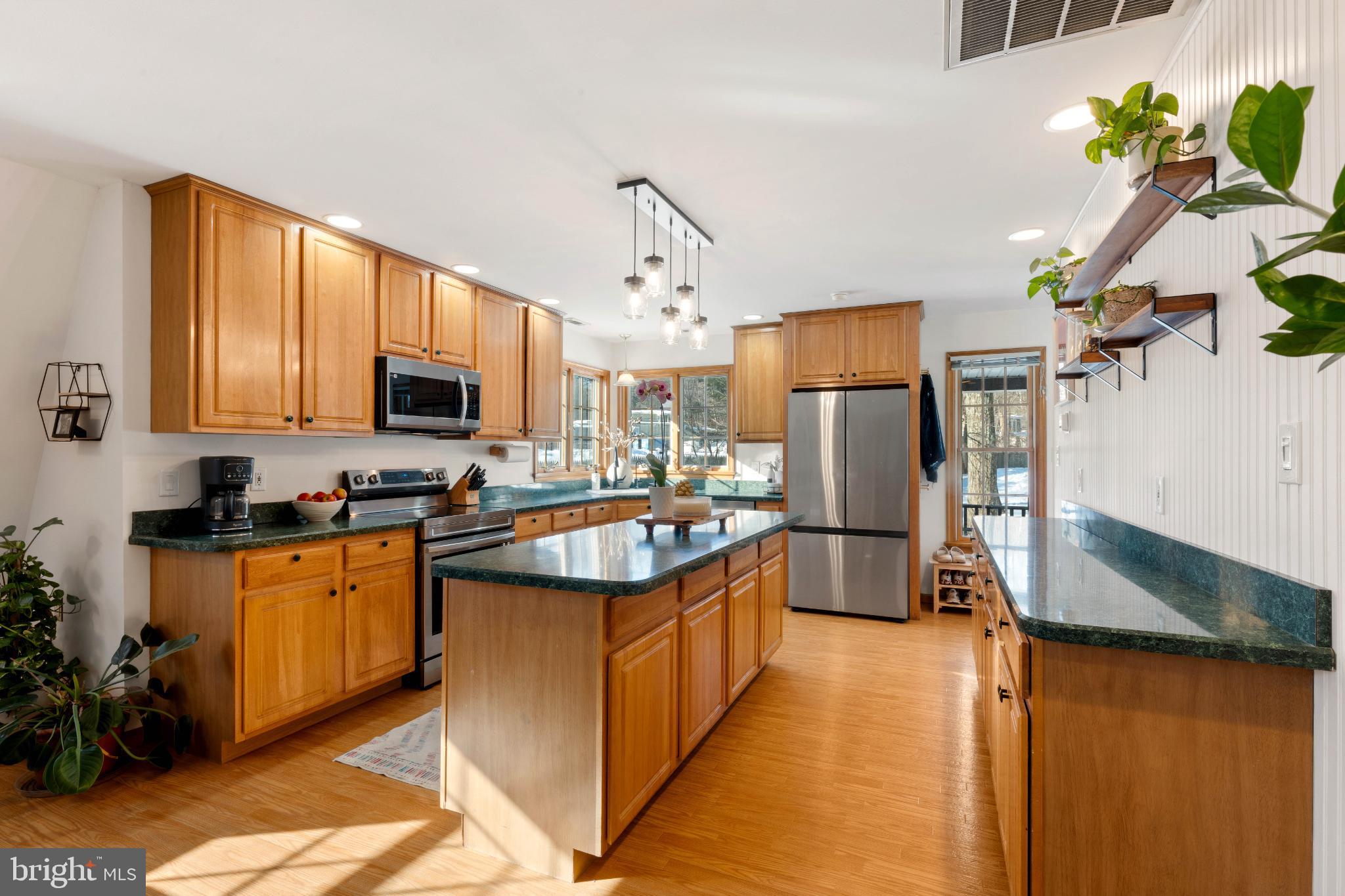 1596 River Road New Hope, PA 18938 - Photo 8 of 39 a kitchen with stainless steel appliances granite countertop a sink stove and refrigerator