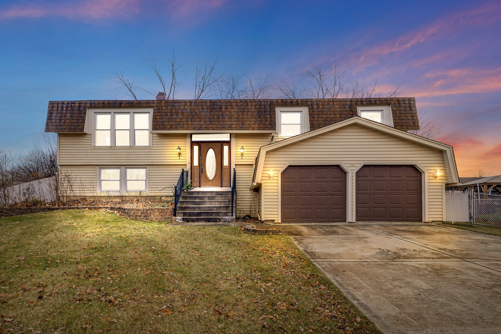 218 Downing Drive Bloomingdale, IL 60108 - Photo 1 of 16 a view of a house with a yard