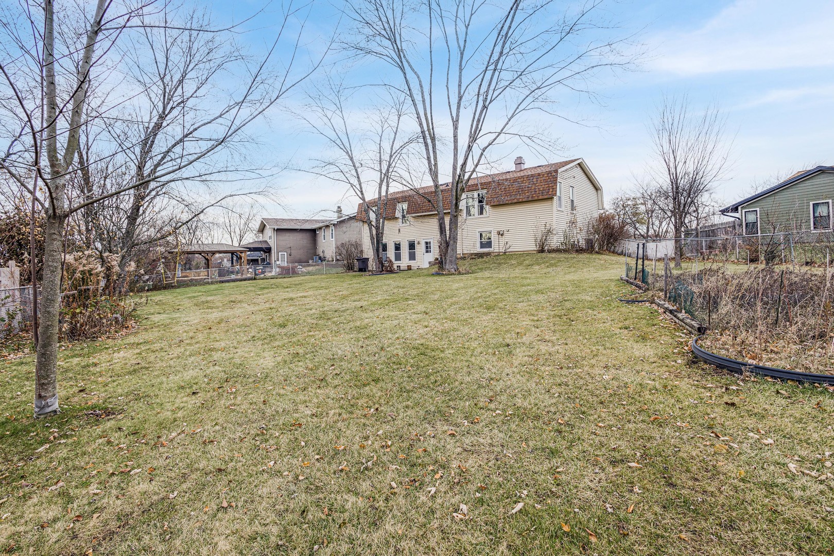 218 Downing Drive Bloomingdale, IL 60108 - Photo 15 of 16 a view of a yard with a house