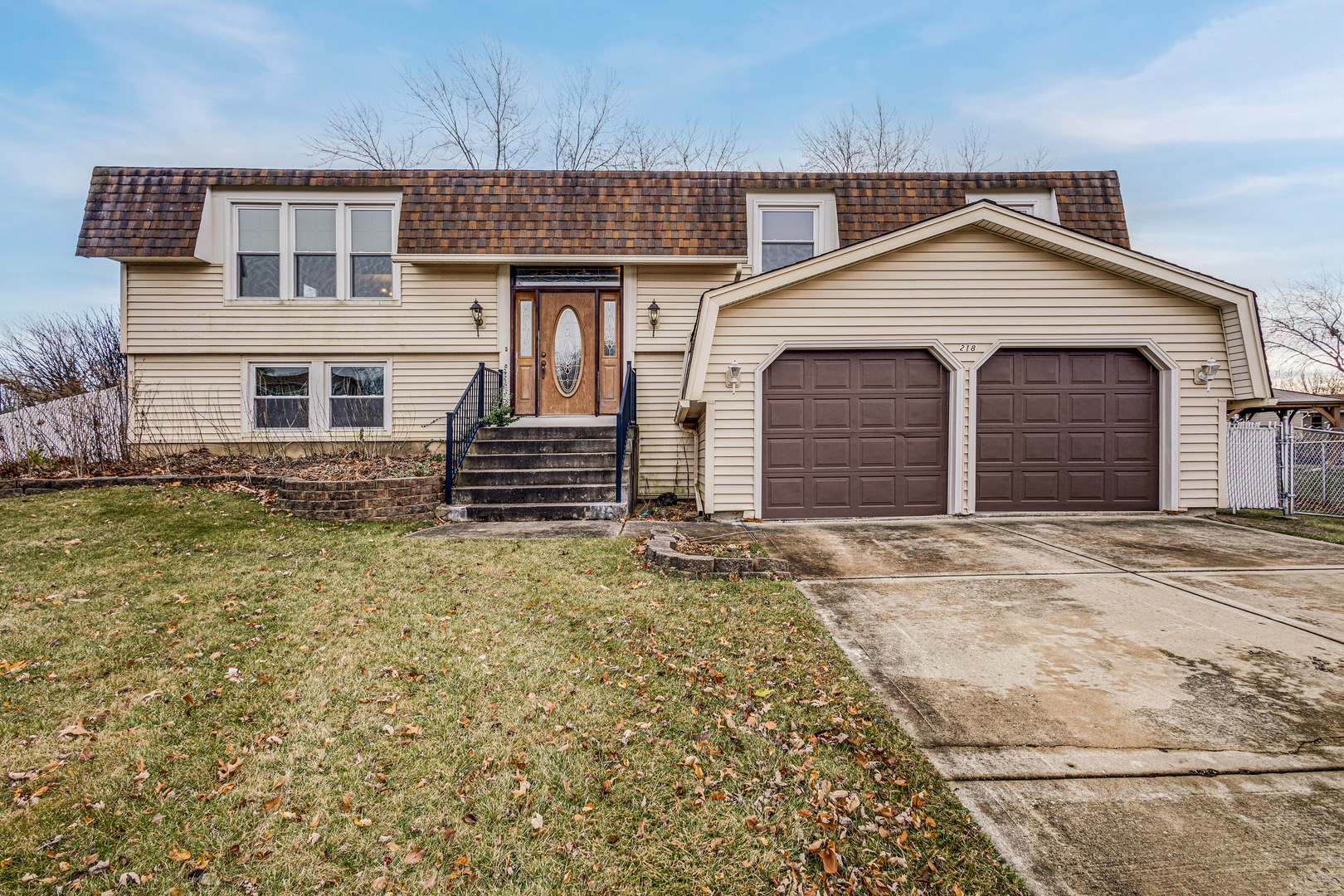 218 Downing Drive Bloomingdale, IL 60108 - Photo 16 of 16 front view of a house and a yard