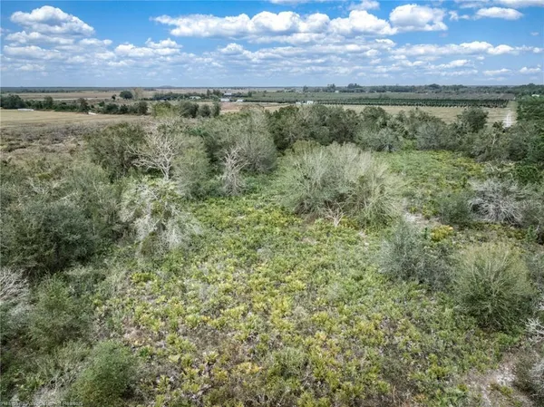 a view of a field with an outdoor space