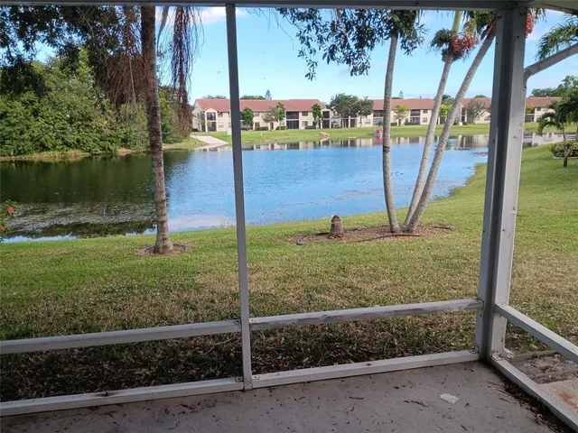 a view of wooden floor and windows in a room