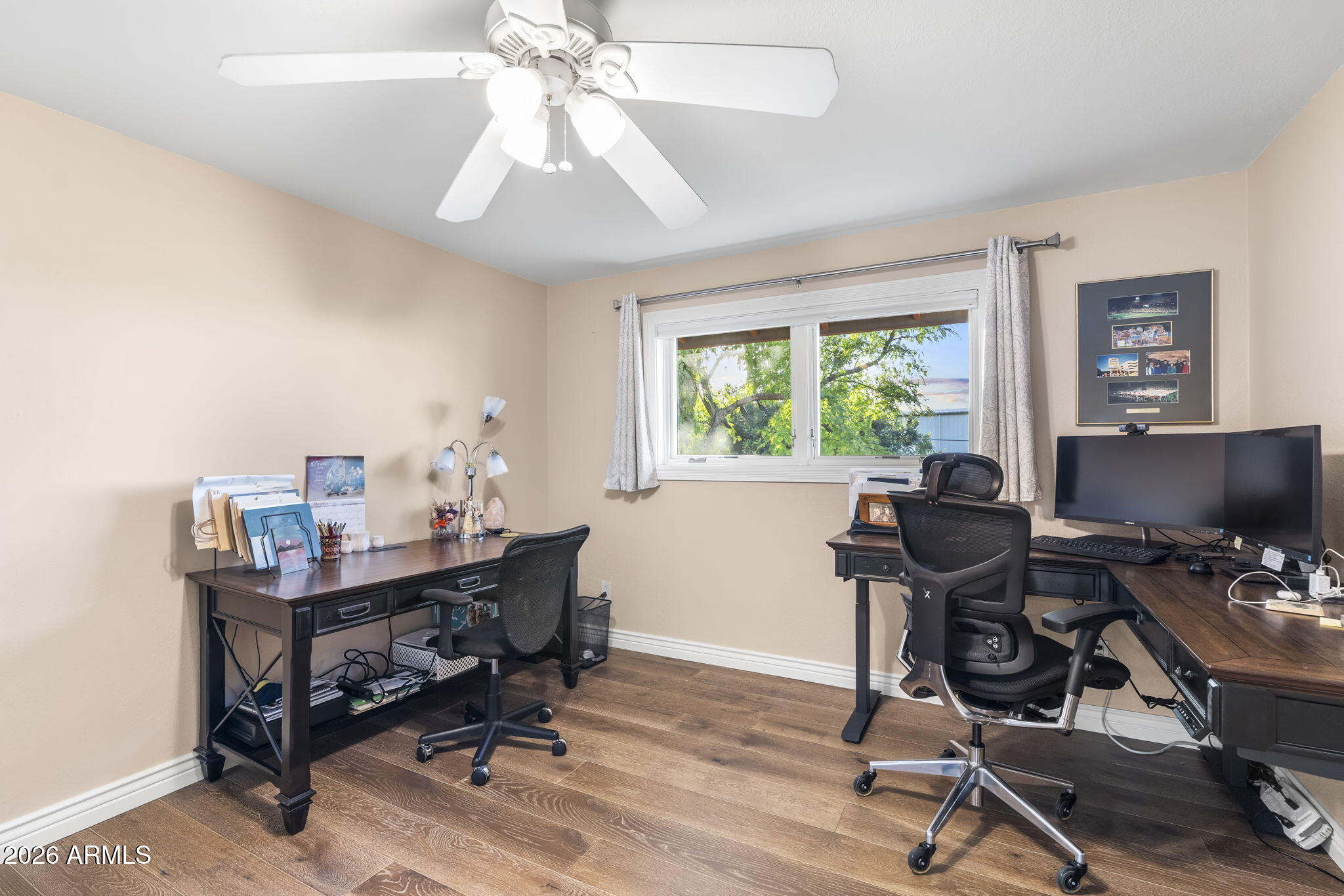 4945 East Cheery Lynn Road Phoenix, AZ 85018 - Photo 13 of 41 a view of a workspace with furniture and a window