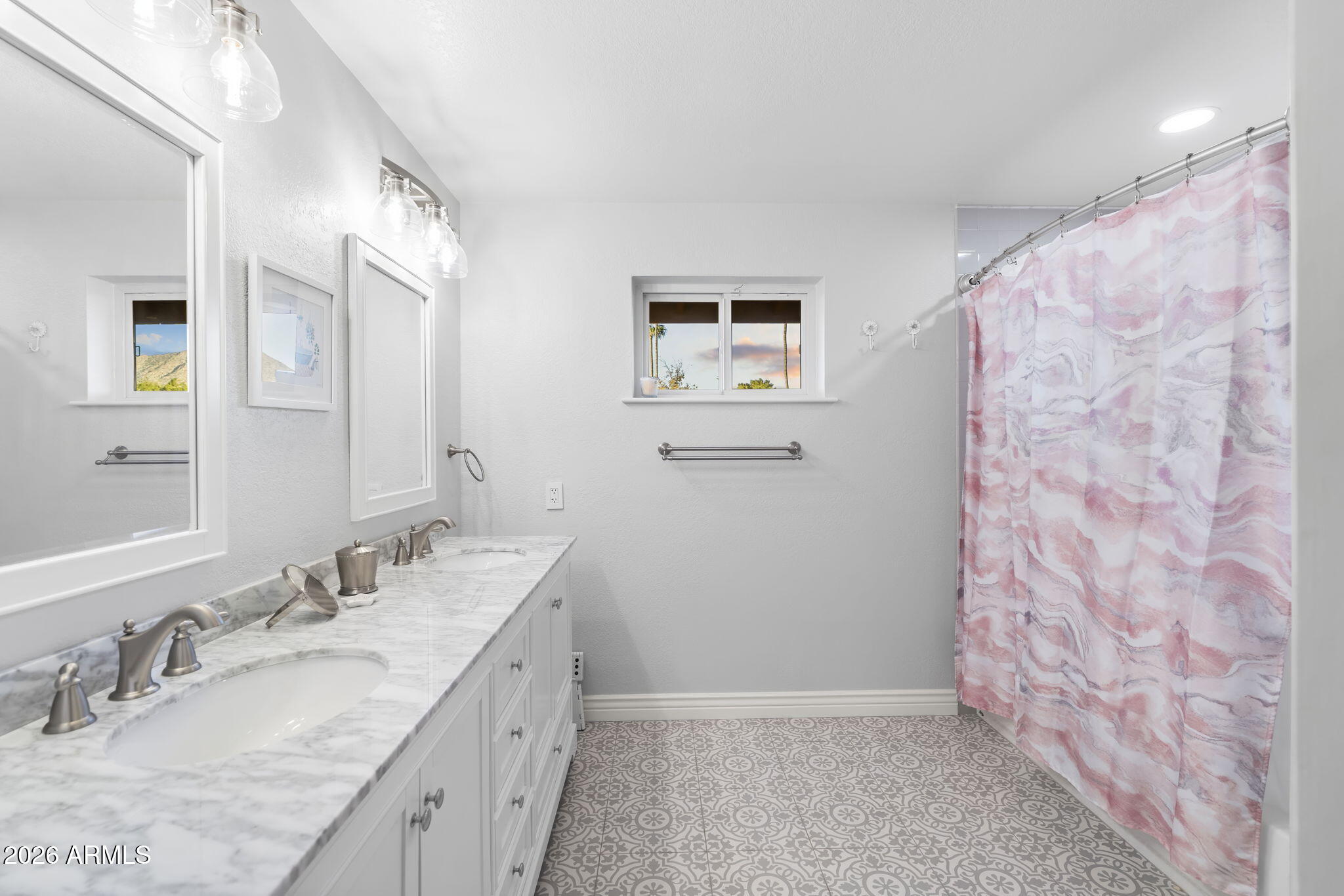4945 East Cheery Lynn Road Phoenix, AZ 85018 - Photo 17 of 41 a bathroom with a granite countertop sink a mirror a vanity and a shower