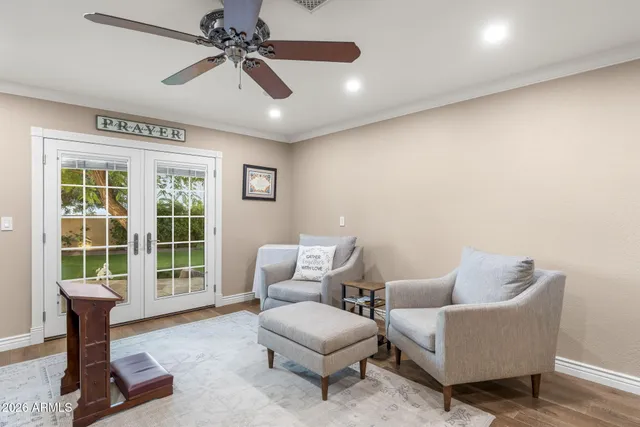 a view of a house with pool and sitting area