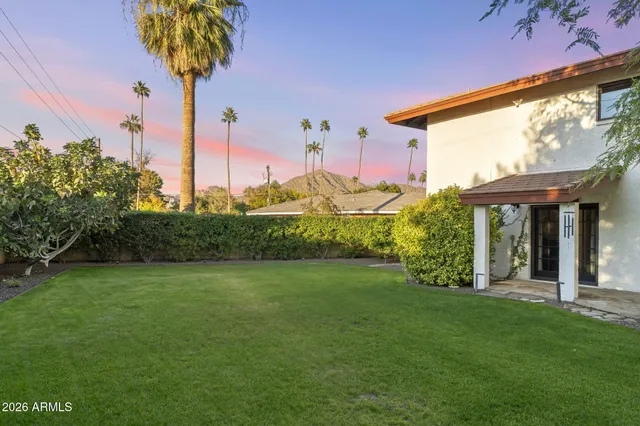 a view of a swimming pool with sitting area
