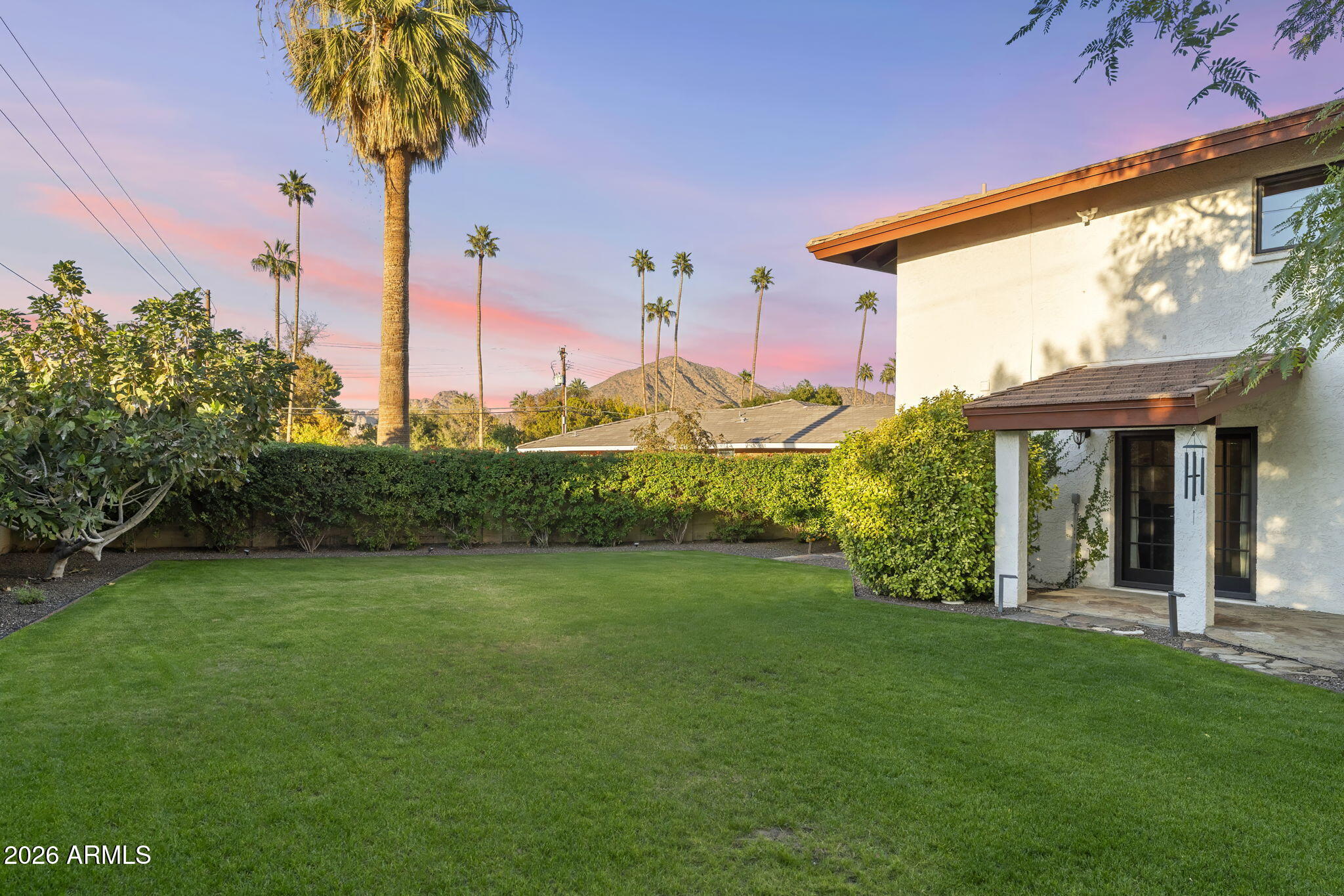 4945 East Cheery Lynn Road Phoenix, AZ 85018 - Photo 24 of 41 a front view of a house with garden