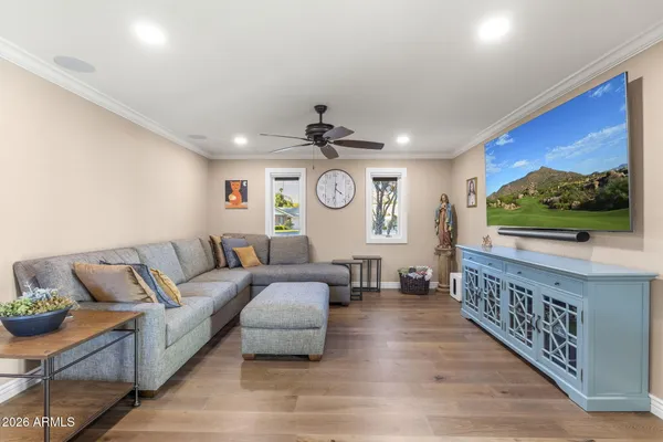 a view of a room with furniture and a window