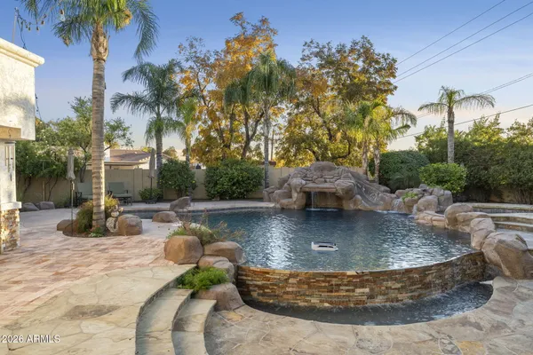 a view of a swimming pool with sitting area