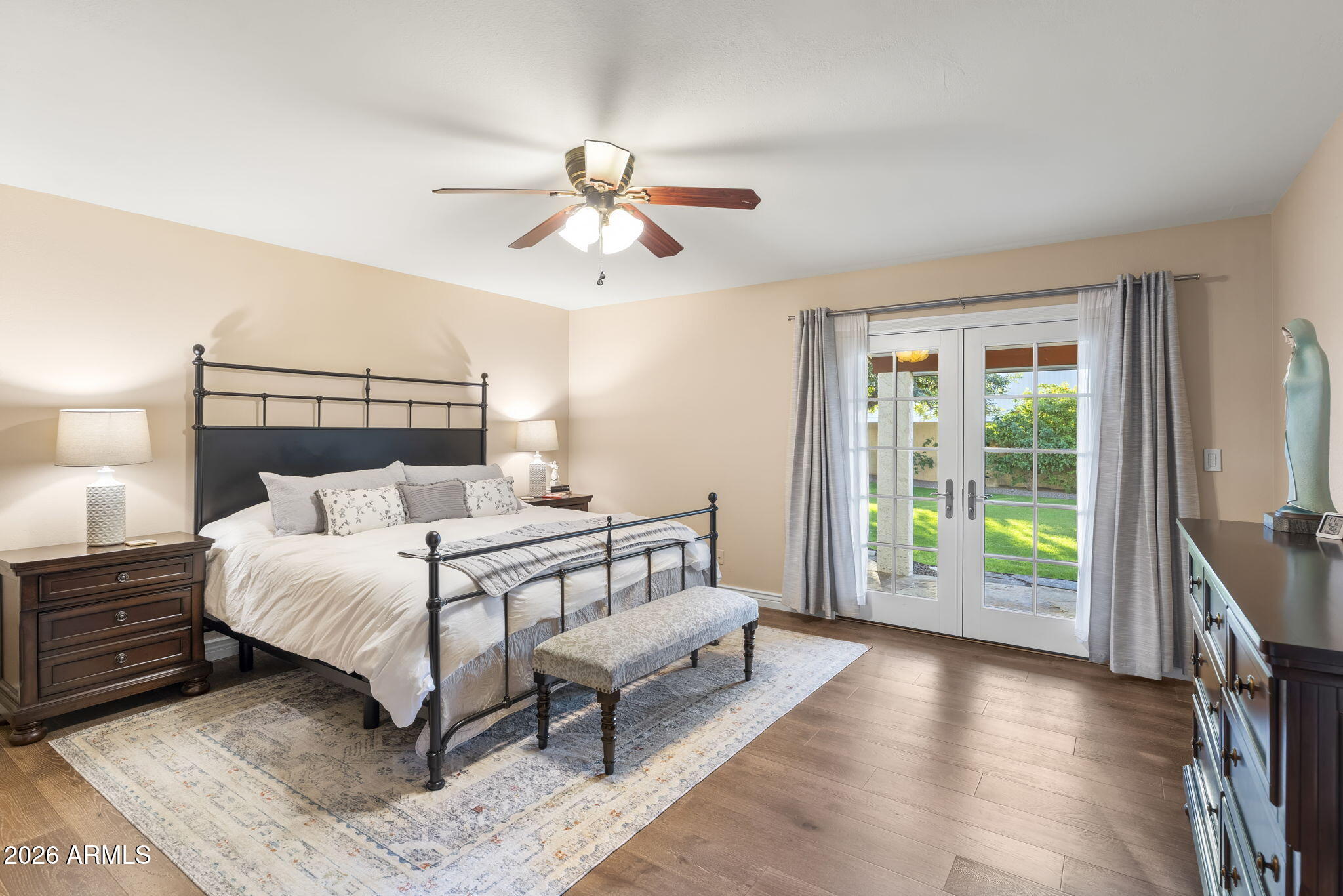 4945 East Cheery Lynn Road Phoenix, AZ 85018 - Photo 9 of 41 a bed sitting in a spacious bedroom next to a window