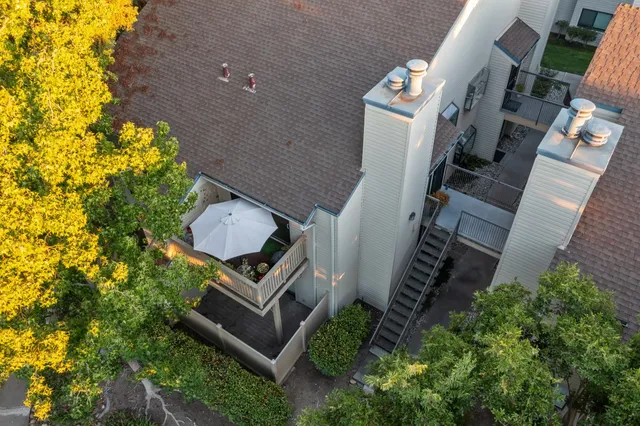 an aerial view of residential houses with outdoor space