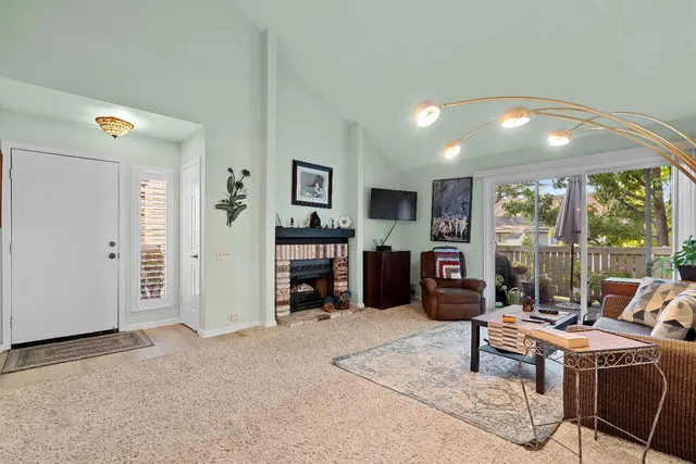 a living room with furniture and large window