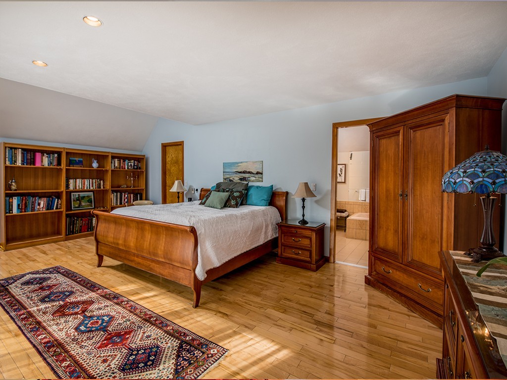 16 McKinley Road Marblehead, MA 01945 - Photo 8 of 13 a bedroom with a bed and wooden floor