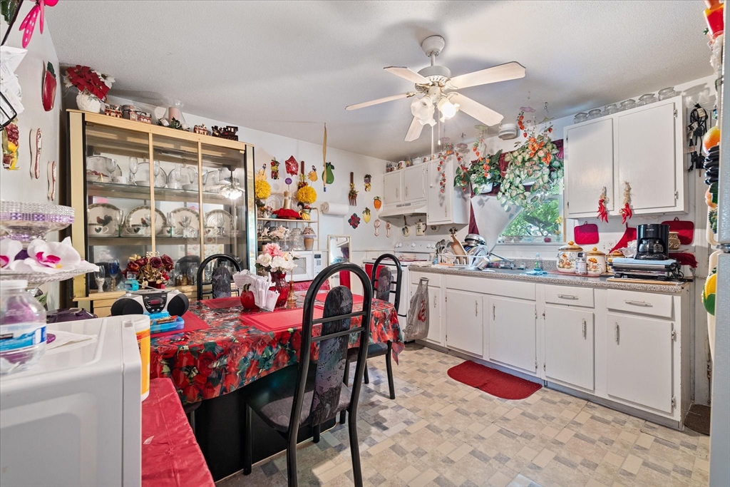 193-195 Nottingham Street Springfield, MA 01104 - Photo 17 of 24 a very nice looking open kitchen with dining table and chairs