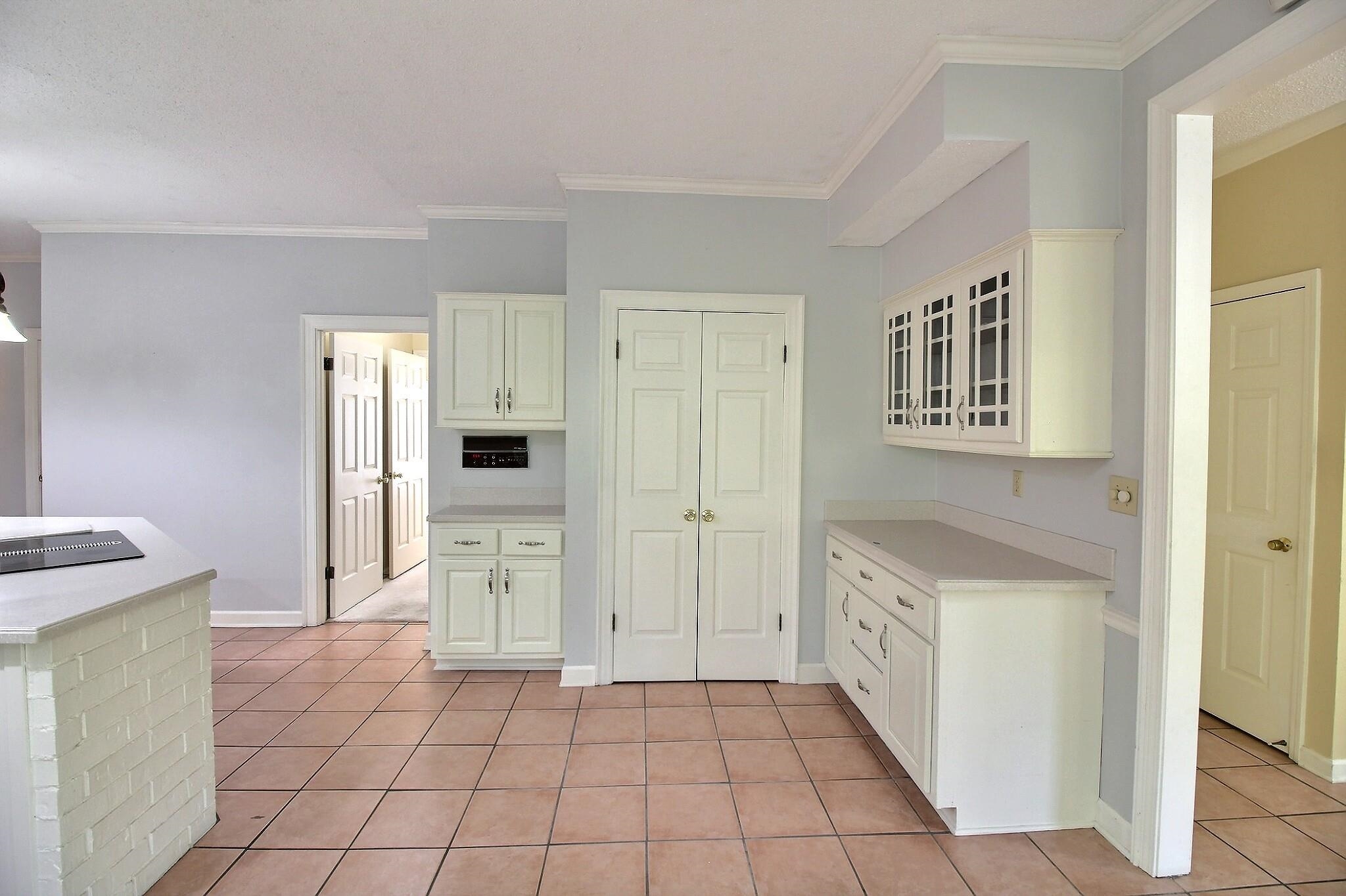 8222 Dogwood Road Germantown, TN 38139 - Photo 12 of 40 a kitchen with a cabinets and a stove top oven