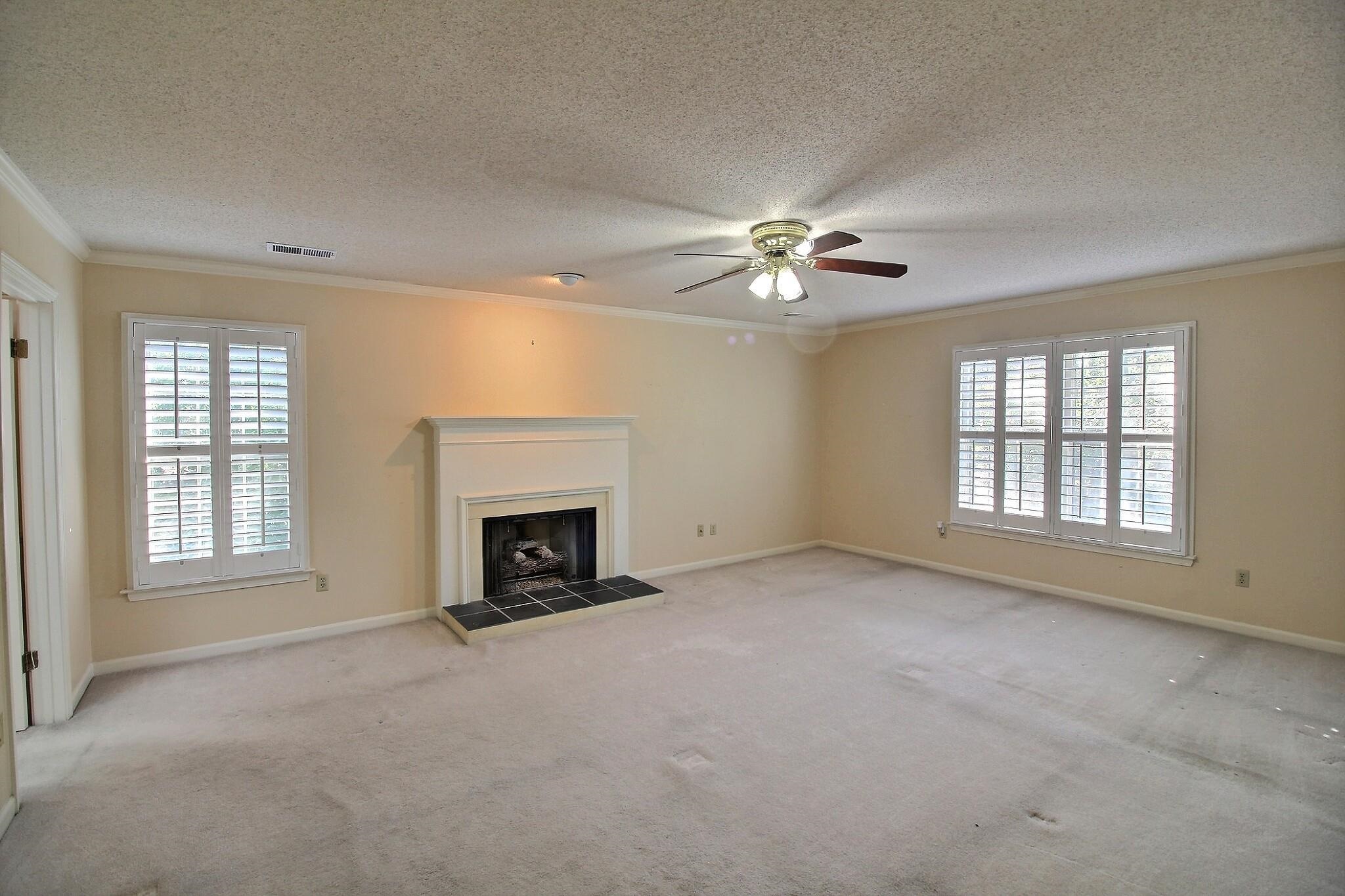 8222 Dogwood Road Germantown, TN 38139 - Photo 23 of 40 an empty room with fireplace and fan
