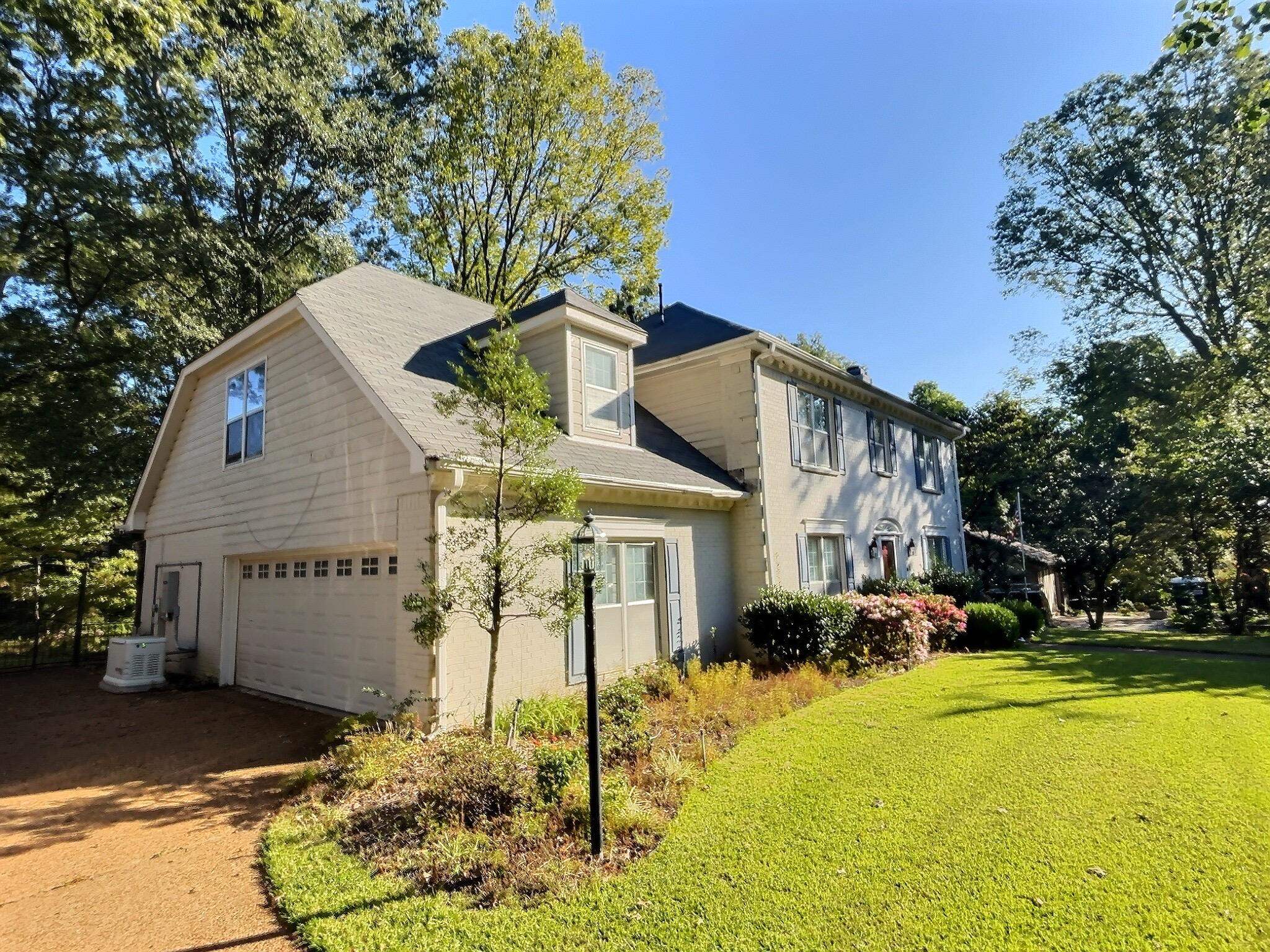 8222 Dogwood Road Germantown, TN 38139 - Photo 3 of 40 a front view of the house with a yard