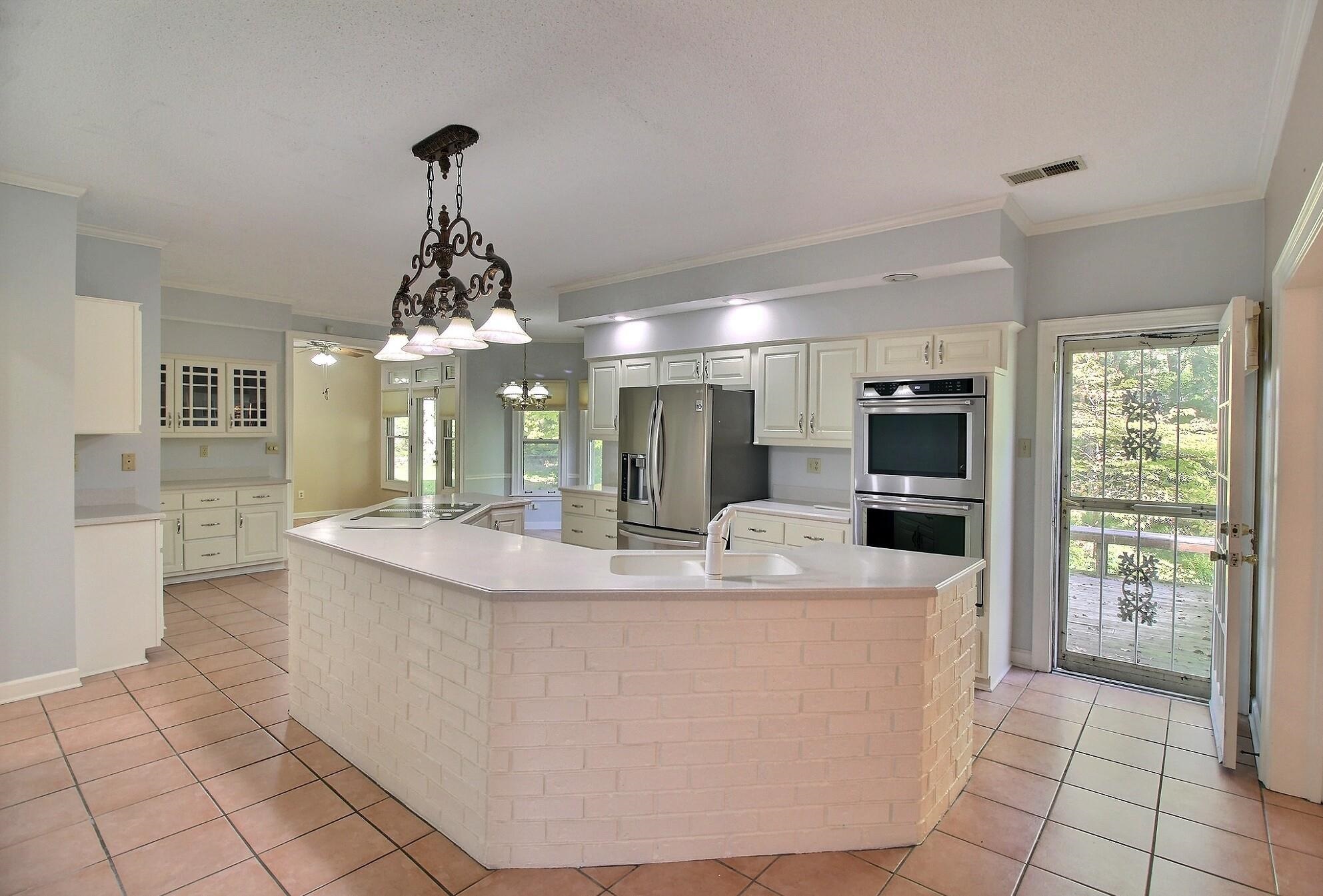 8222 Dogwood Road Germantown, TN 38139 - Photo 7 of 40 a view of living room kitchen with stainless steel appliances granite countertop living room