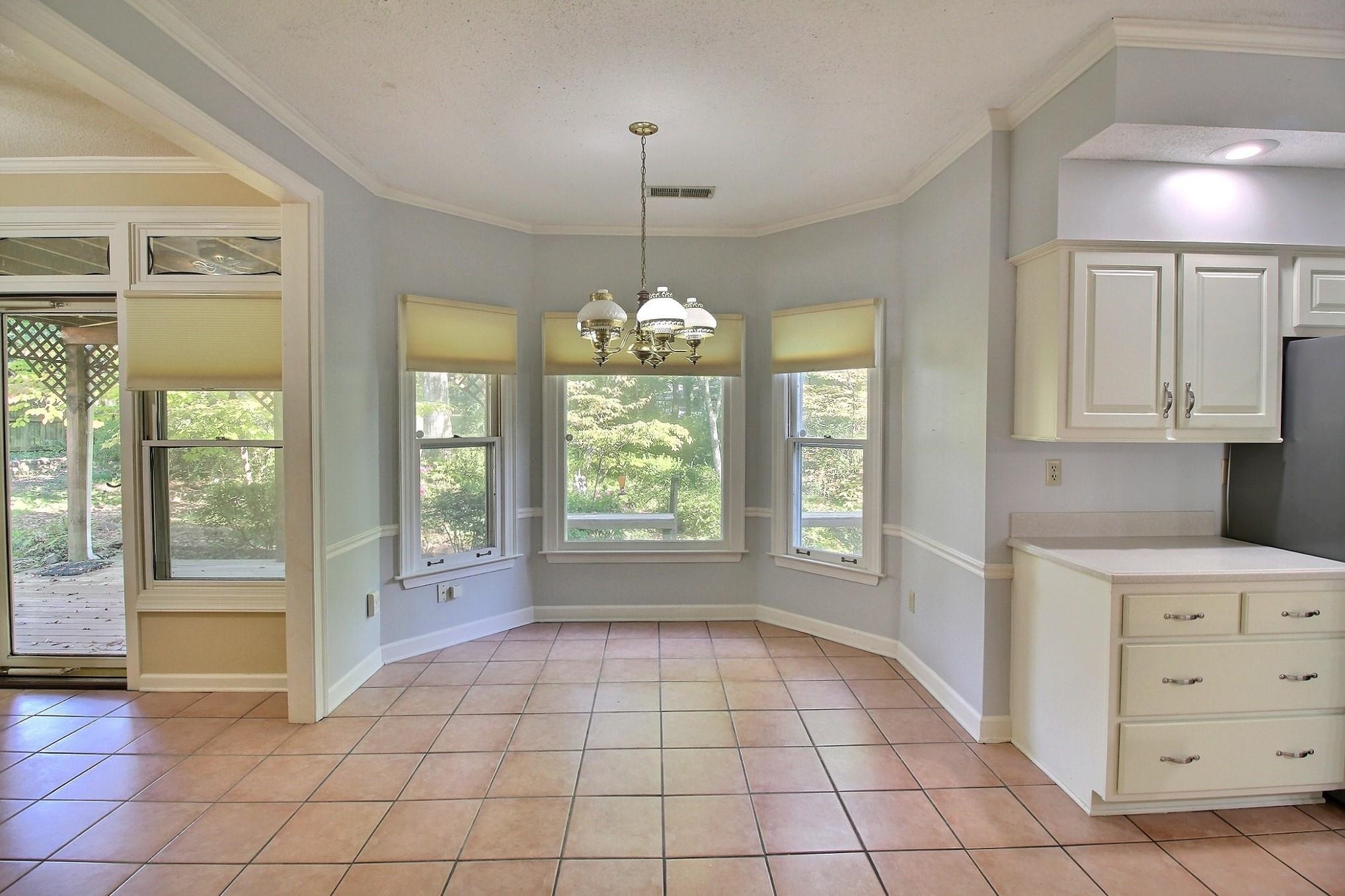 8222 Dogwood Road Germantown, TN 38139 - Photo 9 of 40 a view of an empty room with a window