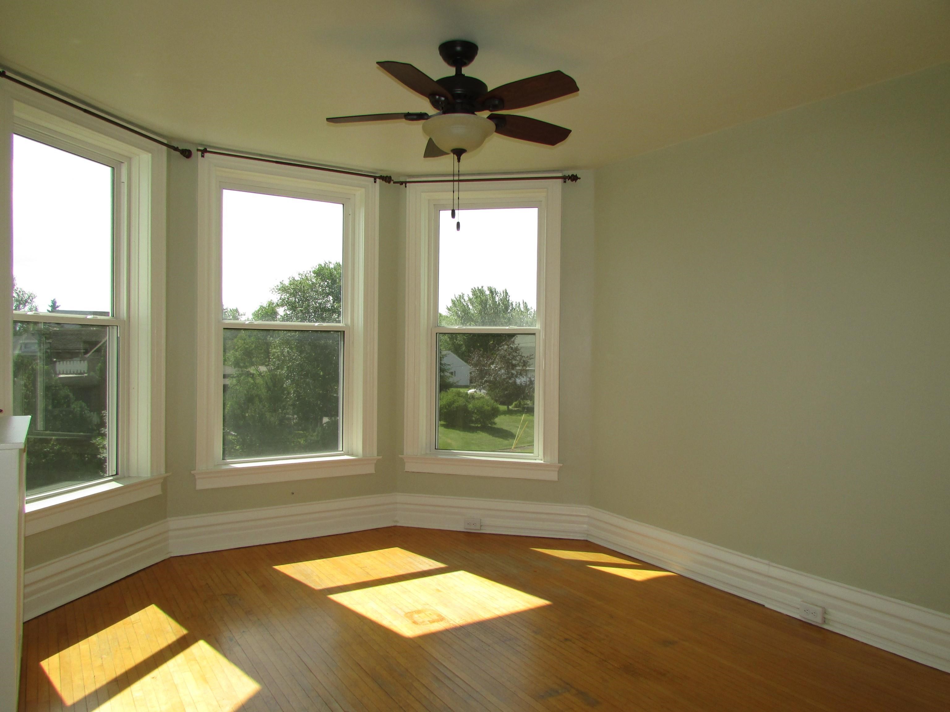 1212 East 2nd Street Superior, WI 54880 - Photo 11 of 19 Unfurnished sunroom with ceiling fan and a wealth of natural light