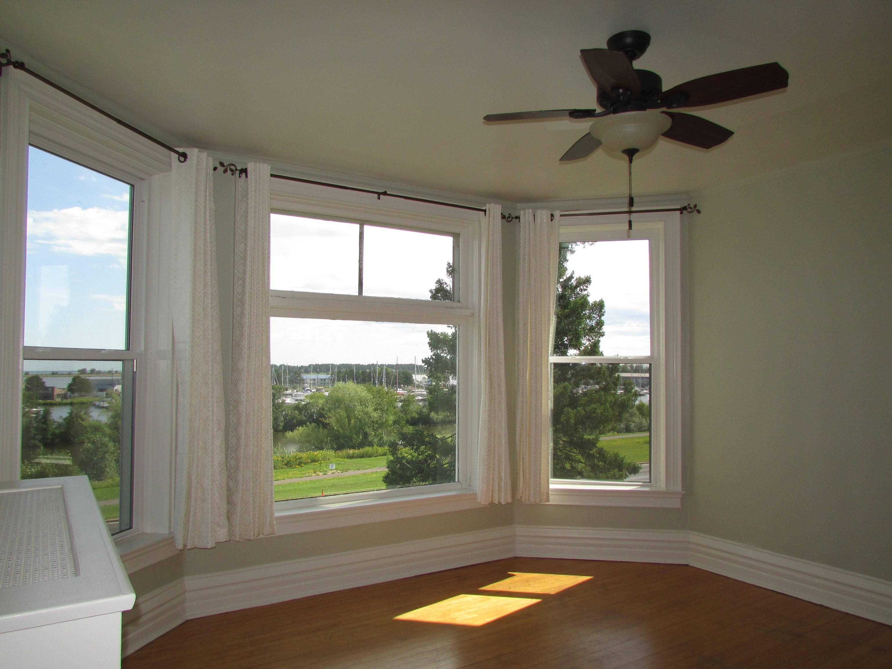 1212 East 2nd Street Superior, WI 54880 - Photo 12 of 19 Unfurnished room with plenty of natural light, hardwood / wood-style flooring, and ceiling fan
