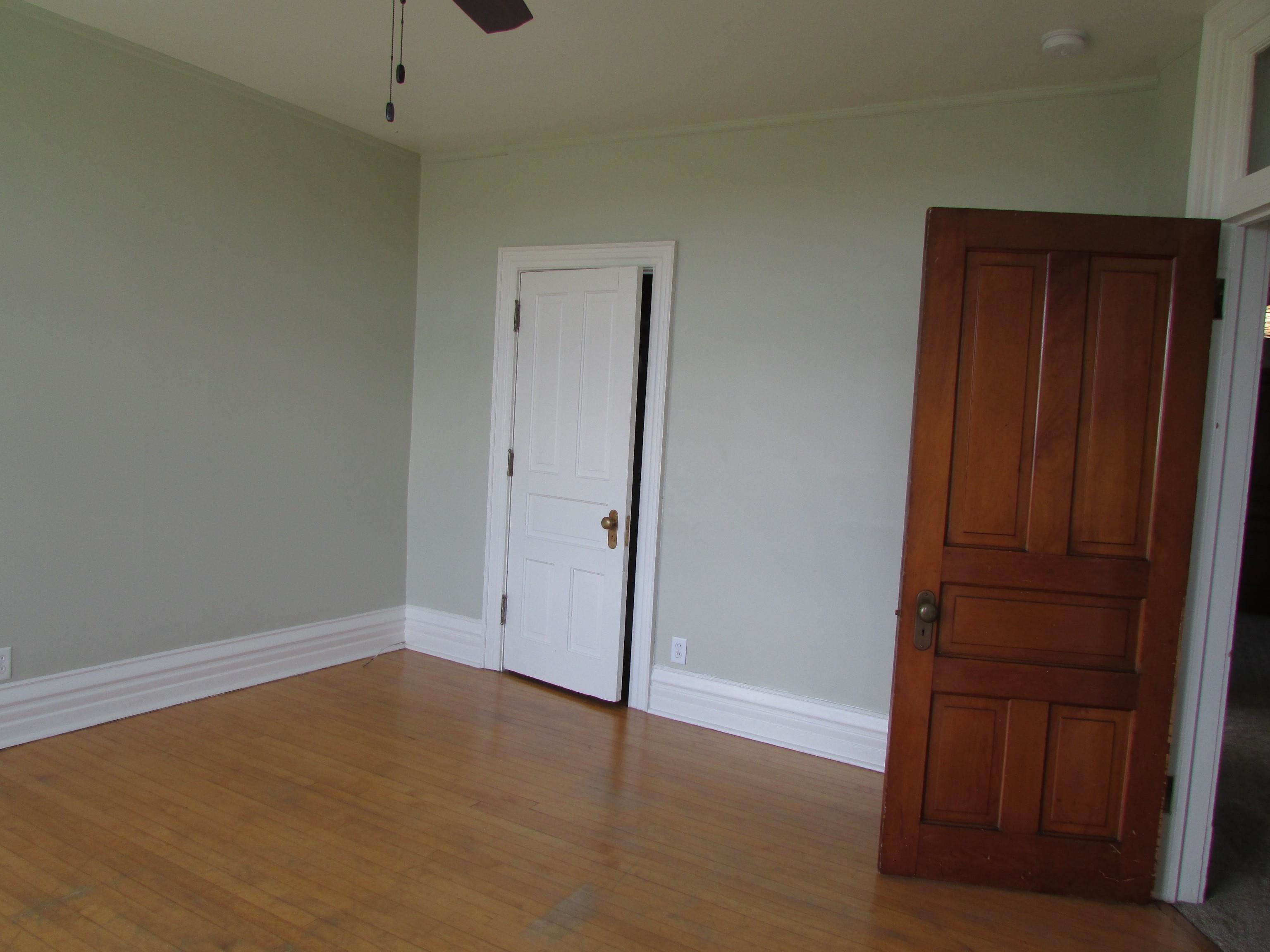 1212 East 2nd Street Superior, WI 54880 - Photo 14 of 19 Unfurnished bedroom with ceiling fan and light hardwood / wood-style flooring