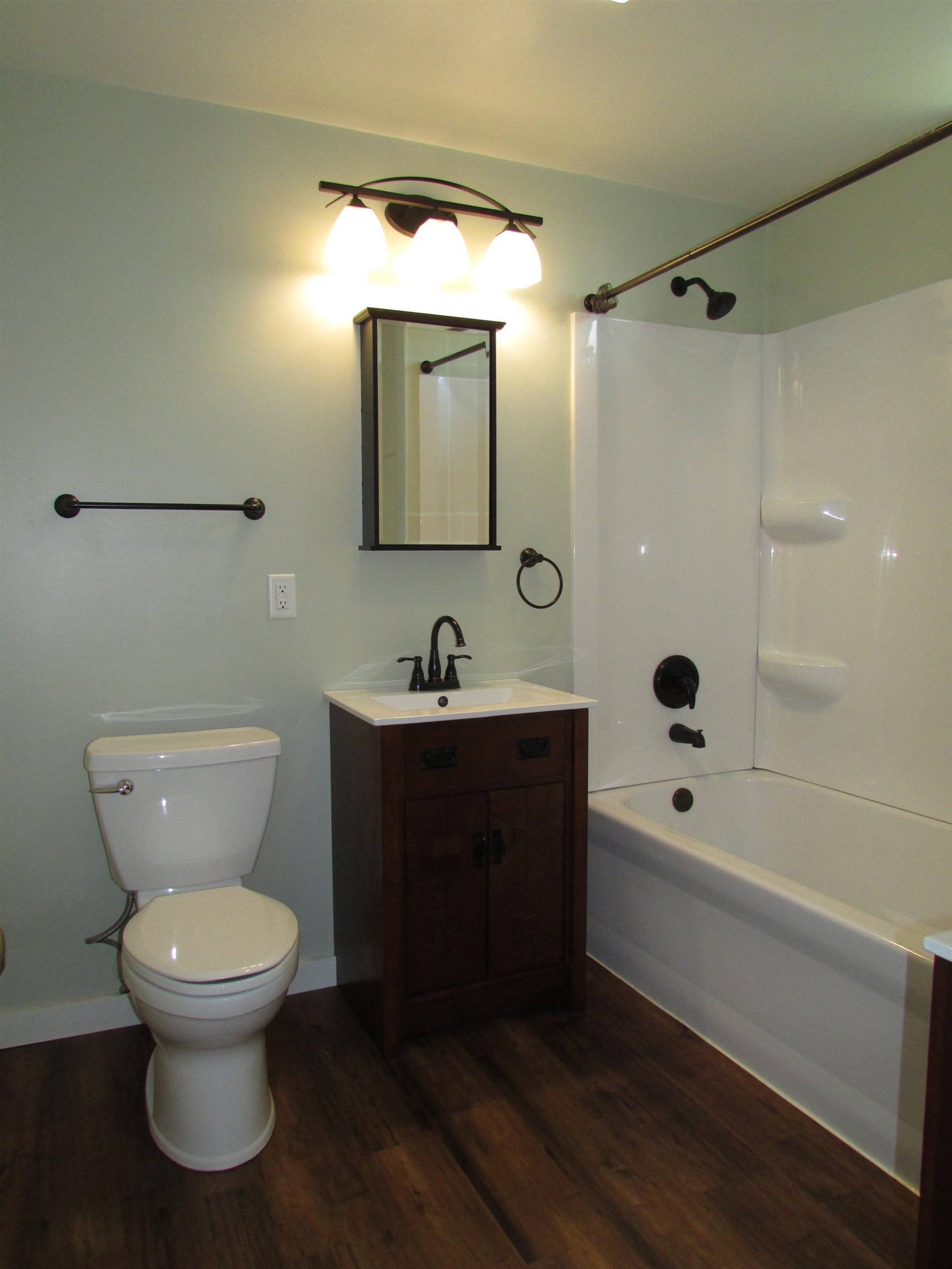 1212 East 2nd Street Superior, WI 54880 - Photo 10 of 19 Full bathroom featuring hardwood / wood-style floors, vanity, shower / washtub combination, and toilet
