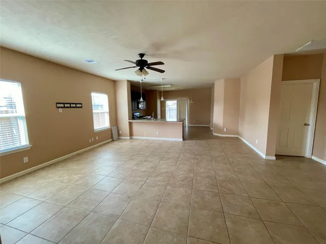 a view of a livingroom with a fireplace and window