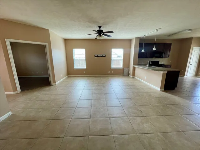 a view of a kitchen with a sink and a stove