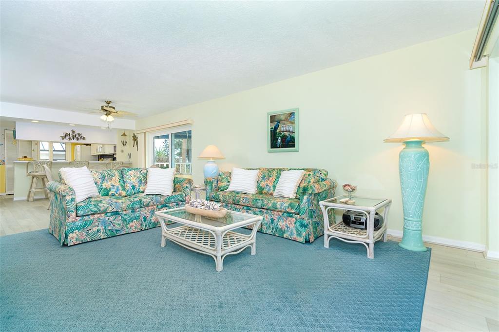 2424 Placida Road, Unit C101 Englewood, FL 34224 - Photo 18 of 65 a living room with furniture and a table